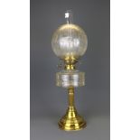 An Edwardian brass and glass oil lamp with frosted shade, H. 62cm.