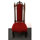 An early 19th Century upholstered carved mahogany nursing chair, H. 108cm.