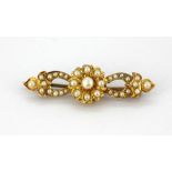 A yellow metal pearl set brooch, L. 4cm.