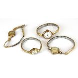Four vintage 9ct gold cased ladies wristwatches, all on gold plated straps.