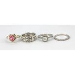 Four 925 silver stone set rings.