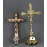 Two early 20th Century crucifixes, tallest 32cm.