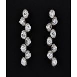 A pair of 18ct white gold (stamped 750) drop earrings set with brilliant cut diamonds, approx. 3.5ct