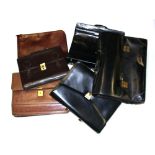 A group of gent's vintage leather briefcases.