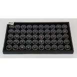 A tray containing 50 un-mounted gemstones, including diamond, peridot, ruby, amethyst, citrine,