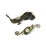 A 1930's white metal malachite and stone set peacock brooch with a white metal and moonstone brooch,