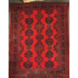 A large 1920's hand woven Eastern wool rug, 313 x 385cm.