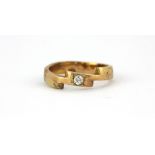 A yellow metal (tested 9ct gold) ring set with an old cut diamond, (Q).