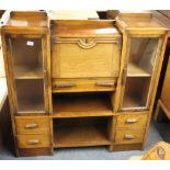 A 1920's oak bureau cabinet, W. 106cm, H. 108cm.