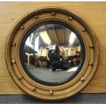 A gilt framed convex mirror, Dia. 58cm.