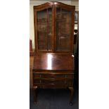 A 1920's fiddle back mahogany veneered bureau bookcase, W. 76cm, H. 193cm.