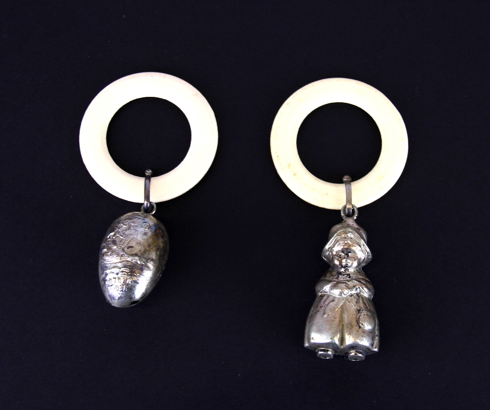 Two hallmarked silver children's rattles.