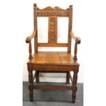 A 19th Century carved oak hall chair.