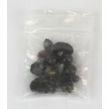 A bag of mixed un-mounted garnet beads, approx. 91ct.