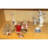 A group of mixed small porcelain dolls and other items.