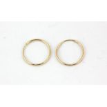 A pair of 9ct yellow gold hoop earrings, Dia. 1.2cm.