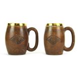 Two carved wooden RAF tankards (one with repaired handle), H. 135cm.