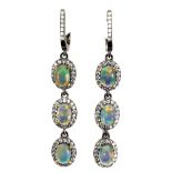 A pair of 925 silver drop earrings set with oval cut opals surrounded by white stones, L. 5cm.