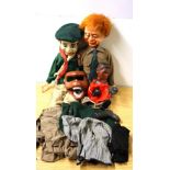 Two celluloid boy Scout ventriloquists dummies, H. 69cm, with a boxing puppet and monkey mask.
