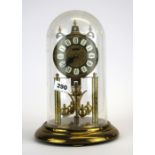 A Haller torsion clock under dome, H. 29cm.