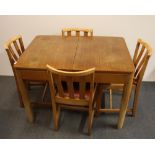 A 1950's extending oak dining table and four satin wood chairs, 106 x 76cm.