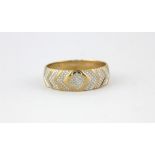 A 9ct yellow and white gold diamond set ring, (T).