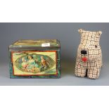 A vintage biscuit tin, 24 x 18 x 16cm, together with a Scotty dog door stop.