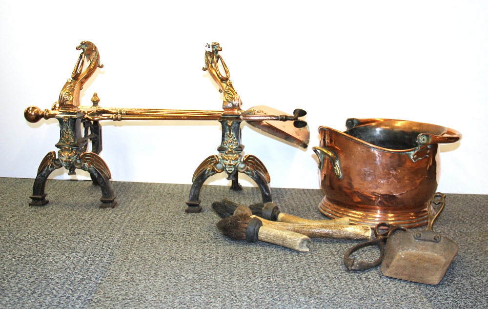 A pair of 19th Century steel and copper fire dogs with copper companion set, bucket and horn handled