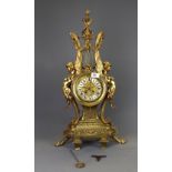 An impressive French gilt brass classical mantle clock with enamelled porcelain numerals, c. 1900,