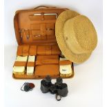 A vintage Tress & Co. straw boater with a gentleman's pig skin travelling case and other items.