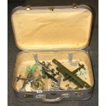 A vintage case containing a collection of plastic model aircraft.