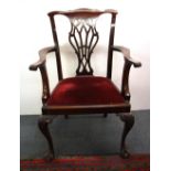 An impressive 19th Century mahogany ball and claw foot carver chair.