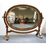 An Edwardian oak dressing table mirror, W. 69cm, H. 53cm.