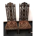 A pair of impressive 19th Century carved oak hall chairs, H. 130cm.