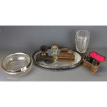 A mirrored silver plated stand with two carved wooden ink wells, together with a further ink well,