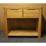 A contemporary light oak two drawer side table, W. 98cm, H. 80cm.