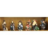 A group of six Chinese glazed terracotta figures of immortals, signed, H. 16cm.