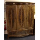 An impressive Edwardian mahogany bow front triple wardrobe, W. 155cm, H. 196cm.