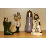 A Wade porcelain cat figure, H. 14cm, with three other items, (boy clown A/F).