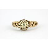 A yellow metal (tested 9ct gold) diamond set cluster ring, some stones missing, (O.5).