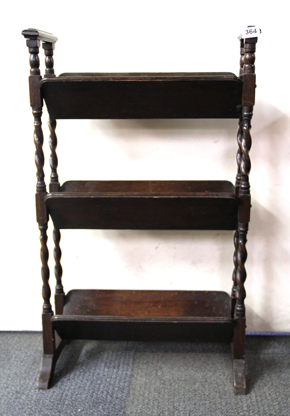 A Victorian oak bookrack, H. 85cm, W. 52cm.