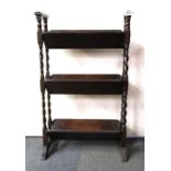 A Victorian oak bookrack, H. 85cm, W. 52cm.