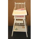 A mid 20th Century baby's metamorphic highchair.