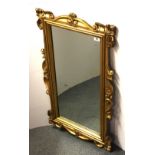 A 19th Century carved gilt wood mirror, 56 x 99cm.