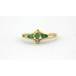 A 9ct yellow gold emerald and diamond set ring, (M).