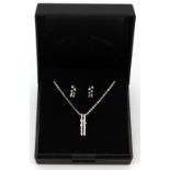 A suite of 9ct white gold diamond set earrings and matching pendant and chain.