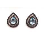 A pair of 925 silver earrings set with pear cut blue topaz and other stones, L. 2.1cm.