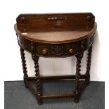 A carved oak console table with barley twist legs, W.76cm, H. 90cm.