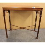 An Edwardian mahogany side table with fretted corner brackets, 76 x 38cm. Condition: some corner