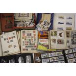 A quantity of stamp albums, loose stamps etc.